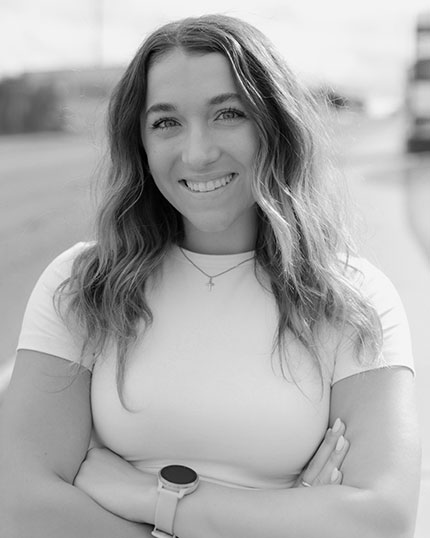 Black and white headshot of Katie Yocca, chiropractor at WPT